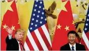  ?? ANDY WONG / ASSOCIATED PRESS ?? President Donald Trump waves in November after attending a joint press conference in Beijing with Chinese President Xi Jinping (right). Trump is planning to impose trade penalties on China.