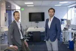  ?? ?? Daniel Huml, left, and Chris Carroll pose for a portrait in Denver on March 22. “Cherry Creek is a bright point in commercial real estate nationally,” Carroll said.