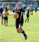  ??  ?? Kyla Emeny from St Josephs takes control of the ball in the Taranaki primary schools’ final.