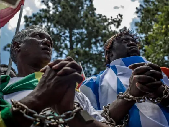  ?? (AFP/Getty) ?? A demonstrat­ion against the trade in Libya, 2017