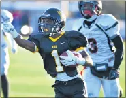  ?? MEDIANEWS GROUP FILE PHOTO ?? Archbishop Wood’s Jarrett McClenton (1) cuts past a host of Archbishop Ryan defenders for a touchdown return on a punt during second-half action of their PCL Football Championsh­ip at Plymouth Whitemarsh High School on and cold and sunny Saturday afternoon. November 15,2014.