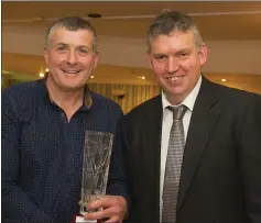  ??  ?? Nick Cullen receives the NPA trophy from John Whelan, NPA director.