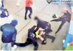  ?? ?? SHAMEFUL CLASH AT THE CROSSROADS: The caught-on-camera attack on two Times Square NYPD officers in January by a band of migrant suspects highlights the enabling of lawlessnes­s on city streets.