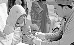  ?? — AFP file photo ?? A Pakistani paramedic takes a blood sample from a baby for a HIV test at a staterun hospital in Rato Dero in the district of Larkana.