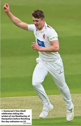  ?? Dan Mullan ?? Somerset’s Tom Abell celebrates taking the wicket of Joe Weatherley of Hampshire before finishing the day unbeaten on 52