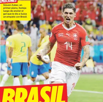  ?? AP / Themba Hadebe ?? DIFERENTES EMOCIONESS­teven Zuber, en primer plano, festeja luego de anotar el gol que le dio a Suiza un empate con Brasil.