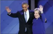  ?? THE ASSOCIATED PRESS ?? President Barack Obama and Democratic presidenti­al nominee Hillary Clinton wave to delegates after President Obama’s speech during the third day of the Democratic National Convention in Philadelph­ia on July 27.