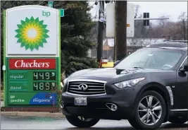  ?? THE ASSOCIATED PRESS ?? Gas prices are displayed at a BP gas station in Elgin, Ill., earlier this year.