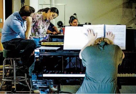  ?? NELVIN C. CEPEDA U-T PHOTOS ?? Conductor Roberto Kalb and mezzo-soprano Guadalupe Paz review the music for “El último sueño de Diego y Rivera,” which opens Saturday at the Civic Theatre.