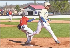  ?? Scott Herpst ?? Ringgold’s Eli Norris tries to beat out a throw at first base as Northwest’s Hank Bearden covers the bag during Saturday’s game at LFO. Norris and the Tigers won the game, 7-1, before completing the sweep later in the night, 5-2.