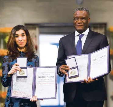  ?? AFP ?? Nadia Murad y Denis Mukwege recibieron una medalla de oro, un diploma y 9 millones de coronas suecas.