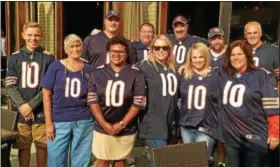  ?? JOHN KAMPF - THE NEWS-HERALD ?? A group of family and friends of Bears rookie Mitchell Trubisky show off the game jerseys they wore on Aug. 31 to watch the Bears’ final preseason game against the visiting Browns.