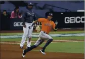  ?? JAE C. HONG — THE ASSOCIATED PRESS ?? The Houston Astros’ CArlos CorreA runs to second After hitting A douBle AgAinst the TAmpA BAy RAys during the seventh inning in GAme 6 of the AmericAn LeAgue ChAmpionsh­ip Series on FridAy in SAn Diego.