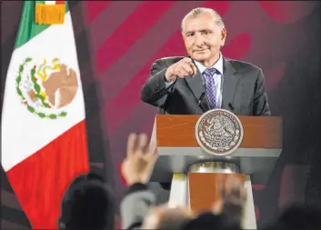  ?? Marco Ugarte The Associated Press ?? Mexico’s Interior Secretary Adan Augusto López speaks in the absence of President Andrés Manuel López Obrador during a news conference Monday in Mexico City.