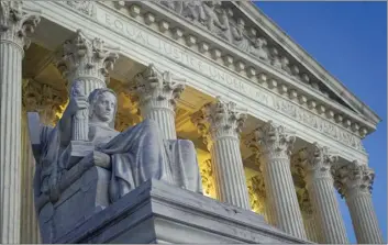  ?? AP file photo ?? Light illuminate­s part of the Supreme Court building on Capitol Hill in Washington on Nov. 16. Eight months, 126 formal interviews and one 23-page report later, the Supreme Court said it has failed to discover who leaked a draft of the court’s opinion overturnin­g abortion rights.