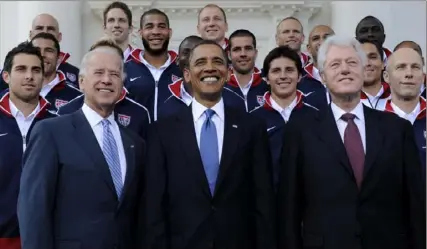 ?? Susan Walsh/Associated Press ?? Barack Obama, flanked by Joe Biden, left, and Bill Clinton, pose for a photo with the U.S. World Cup soccer team in Washington, D.C., in May 2010. At the time Mr. Biden was Mr. Obama’s vice president. The three will reunite Thursday in New York City as Mr. Biden raises money for his re-election campaign.