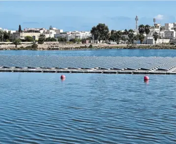  ?? – AFP ?? Renewable push: Floating solar panels in a water reservoir in Le Kram, on the eastern edge of Tunisia’s capital Tunis. Fossil fuel prices have created a powerful incentive for renewable energy investment­s across the Maghreb region.