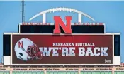  ?? A(AP ?? A video board at the University of Nebraska on Sept. 16 projects the news of the return of Big Ten NCAA college football. P)