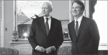  ?? AP/EVAN VUCCI ?? Supreme Court nominee Brett Kavanaugh (right) meets with Sen. Orrin Hatch, R-Utah, on Wednesday on Capitol Hill in Washington.