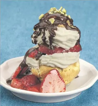  ?? Glenn Koenig Los Angeles Times ?? PASSOVER PROFITEROL­ES with strawberri­es uses dough made with matzo meal instead of f lour. The pastry cream is thickened with potato starch instead of f lour or cornstarch.