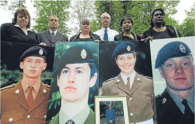  ?? Picture: PA. ?? From left: relations Yvonne Heath, Jim Collinson, Diane Gray, Geoff Gray, Deveen Clarke and Glasme Davis hold picture boards of soldiers who died while serving at Deepcut barracks in Surrey. They are, from left: Sean Benton, Geoff Gray, Cheryl James,...