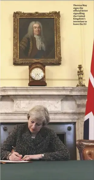  ?? PHOTO: GETTY IMAGES ?? Theresa May signs the official letter signalling the United Kingdom’s intention to leave the EU