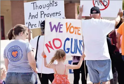  ?? Buy these photos at YumaSun.com PHOTOS BY RACHEL TWOGUNS/YUMA SUN ?? YUMANS GATHERED TOGETHER on Saturday morning as part of the national campaign March For Our Lives, which aims to address gun violence in the United States. Participan­ts of the march met at Marcus Park and marched to Yuma’s City Hall.