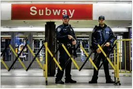  ?? ANDRES KUDACKI / AP ?? Police stand guard inside the Port Authority Bus Terminal following an explosion during morning rush hour Monday near Times Square in New York. The only serious wounds were to the suspect, a Bangladesh­i immigrant, authoritie­s said.