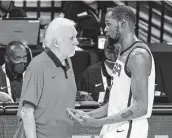  ?? Ethan Miller / Getty Images ?? Team USA coach Gregg Popovich, left, is confident his team will bounce back from the exhibition loss.