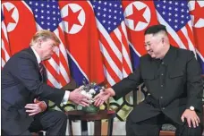  ?? SAUL LOEB / AFP ?? United States President Donald Trump and Democratic People’s Republic of Korea top leader Kim Jong-un shake hands following a meeting in Hanoi, Vietnam, on Wednesday.