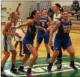  ?? DAVID S. GLASIER — THE NEWS-HERALD ?? Ursuline College’s Laney Lewis (21) and Camryn Hill battle for rebound position against Lake Erie on Jan. 27.