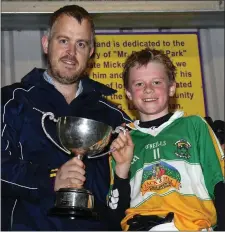  ??  ?? Johnny Murphy presents the cup to James Lawless.