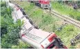  ??  ?? LOSING CONTROL: The derailed train in Eseka, Cameroon.