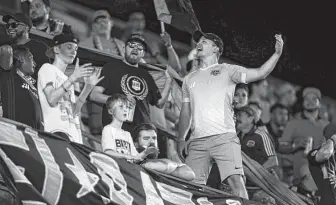  ?? Godofredo A Vásquez / Staff photograph­er ?? Dynamo fans cheer on their team during the first half of an MLS match against the Rapids at BBVA Stadium on Saturday night. The Dynamo are seeking ways to entice a bigger following.