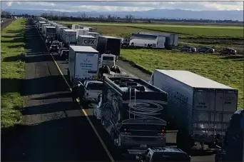  ?? HOGP VIA AP ?? This Feb. 14, 2019, photo released by Caltrans District 3shows a 7-mile back up on the South bound Interstate 5, as it reopens to traffic in Maxwell in Colusa County, Calif. The Trump administra­tion is poised revoke California’s authority to set auto mileage standards, asserting that only the federal government has the power to regulate