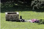  ?? ?? NAP TIME: Vagrants sleep on the grounds at Fort Frederick