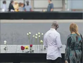  ?? Bryan R. Smith AFP/Getty Images ?? PEOPLE VISIT the 9/11 Memorial and Museum last month. About 9,000 plaintiffs seek reparation­s from Saudi Arabia, homeland of 15 of the 19 hijackers.