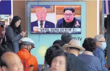  ?? AHN YOUNG JOON/ASSOCIATED PRESS ?? People at the Seoul Railway Station in Seoul, South Korea, watch a TV screen showing images of U.S. President Donald Trump, left, and North Korean leader Kim Jong Un during a news program Tuesday.