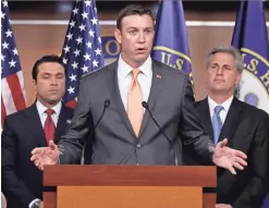  ?? CAROLYN KASTER/AP ?? Rep. Duncan Hunter, R-Calif., center, was still a rising star on Capitol Hill in 2011. He was first elected in 2008, to his father’s former seat.