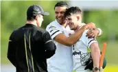  ?? VLOTMAN Picture: GALLO IMAGES/ASHLEY ?? CENTRE STAGE: Jordan Hermann is congratula­ted by his teammates Matthew Breetzke and Diego Rosier after his huge hundred helped the Warriors to victory over the Rocks on day three of their CSA 4-Day Domestic Series match in Paarl on Saturday.