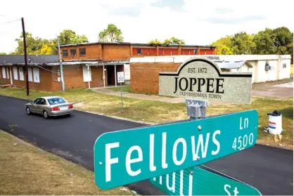  ?? The Dallas Morning News via AP ?? Melissa Pierce, a former all-black school, is shown Oct. 2 in the Joppa neighborho­od in Dallas. The neighborho­od has historical­ly been pronounced “Joppee” but has been spelled “Joppa,” so signs in the neighborho­od can bear either spelling.