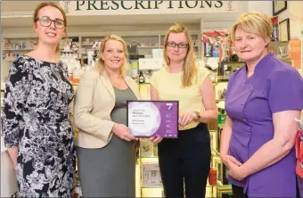  ??  ?? Sinead Gibbons and Karen Downey, MSD, with Sarah Magner and Ann Murphy from Mullins Pharmacy at the award of the Crystal Clear Literacy Mark by NALA and MSD. Photo by John Allen.