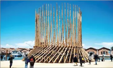  ?? AFP ?? Visitors view How will we live together, Chileans and Mapuche? Building places to get to know each other [Kunu] Building places to parley [Koyau-we] at Chile’s pavilion at the 17th Venice Architectu­re Biennale in Venice.