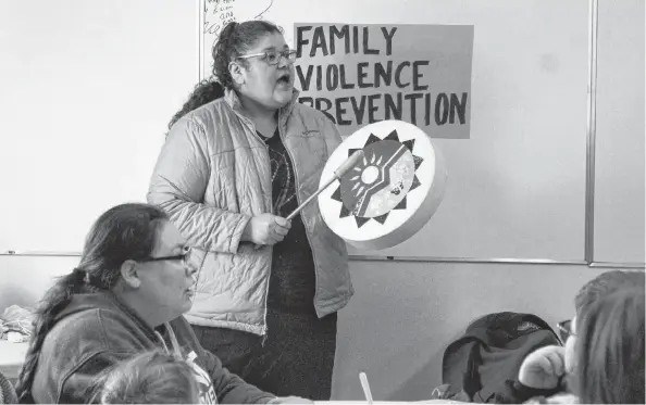  ?? NIKKI SULLIVAN/CAPE BRETON POST ?? Karina Matthews-Denny sings the Eagle song before the lunch of homemade pizza and beef stew at the end of the March Against Family Violence. The mother of six said events like this help spread awareness “so people can know there are avenues for help.”