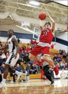  ?? TIM PHILLIS — THE NEWS-HERALD ?? Shane Zalba of Mentor goes up for a shot against Solon Dec. 22.