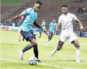  ?? ?? Menzi Masuku keeps a close eye on Lwandile Mabuya, who gave away an unfortunat­e penalty but otherwise had a steady game at the back