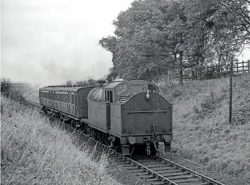  ?? LCLRHVT/WILLIAM WOOLHOUSE ?? Below: A beefy A5 4-6-2 tank tank engine returns from Horncastle towards Woodhall Junction on an unknown date. The trackbed is now a much-used walking and cycling trail.