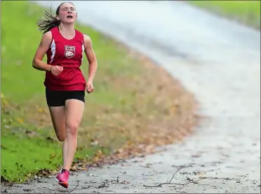  ?? SEAN D. ELLIOT/THE DAY ?? NFA freshman Catie Shannon sprints to the finish line to win individual honors during Tuesday’s ECC Division I girls’ cross country meet against East Lyme at Mohegan Park in Norwich. East Lyme won the meet 24-31.