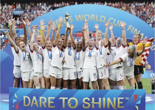  ?? AP ?? The U.S. women’s national team, celebratin­g after winning the World Cup in 2019, can now celebrate a landmark deal that establishe­s equal pay with the men’s team.