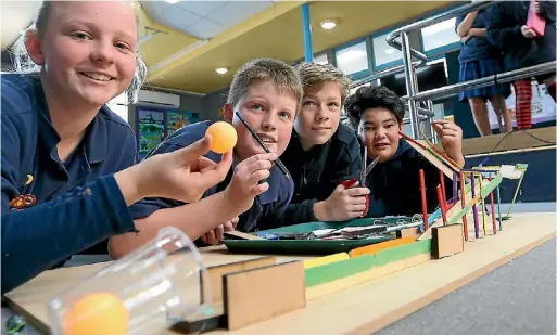  ?? PHOTO: SCOTT HAMMOND/STUFF ?? Bohally year 8 students, from left, Georgia Morrison, Cameron Mckenzie, Ayden Reece and Caelen Marcroft show off their Rube Goldberg device.